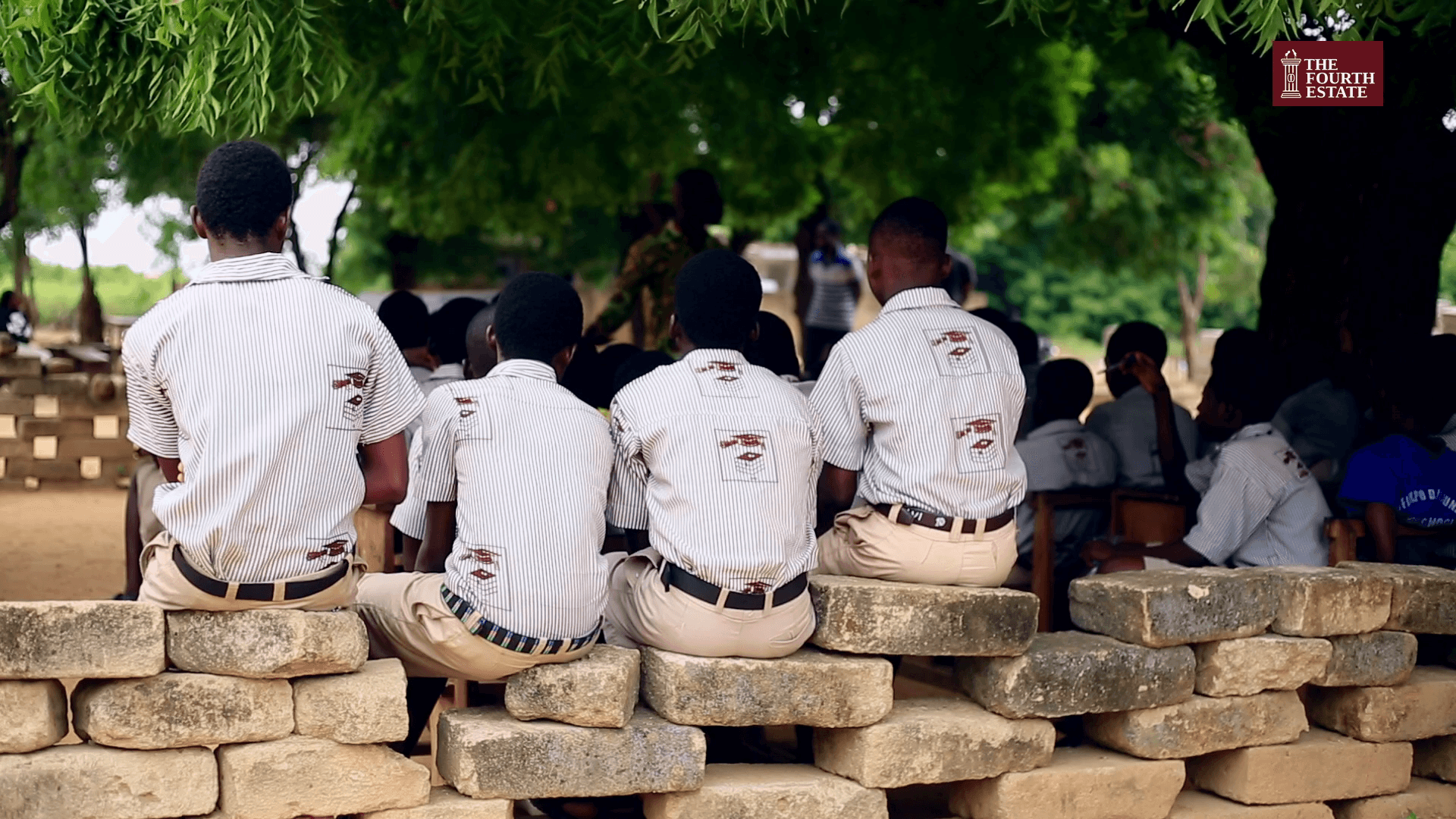 Two abandoned classroom projects leave Toflokpo pupils learning under a tree