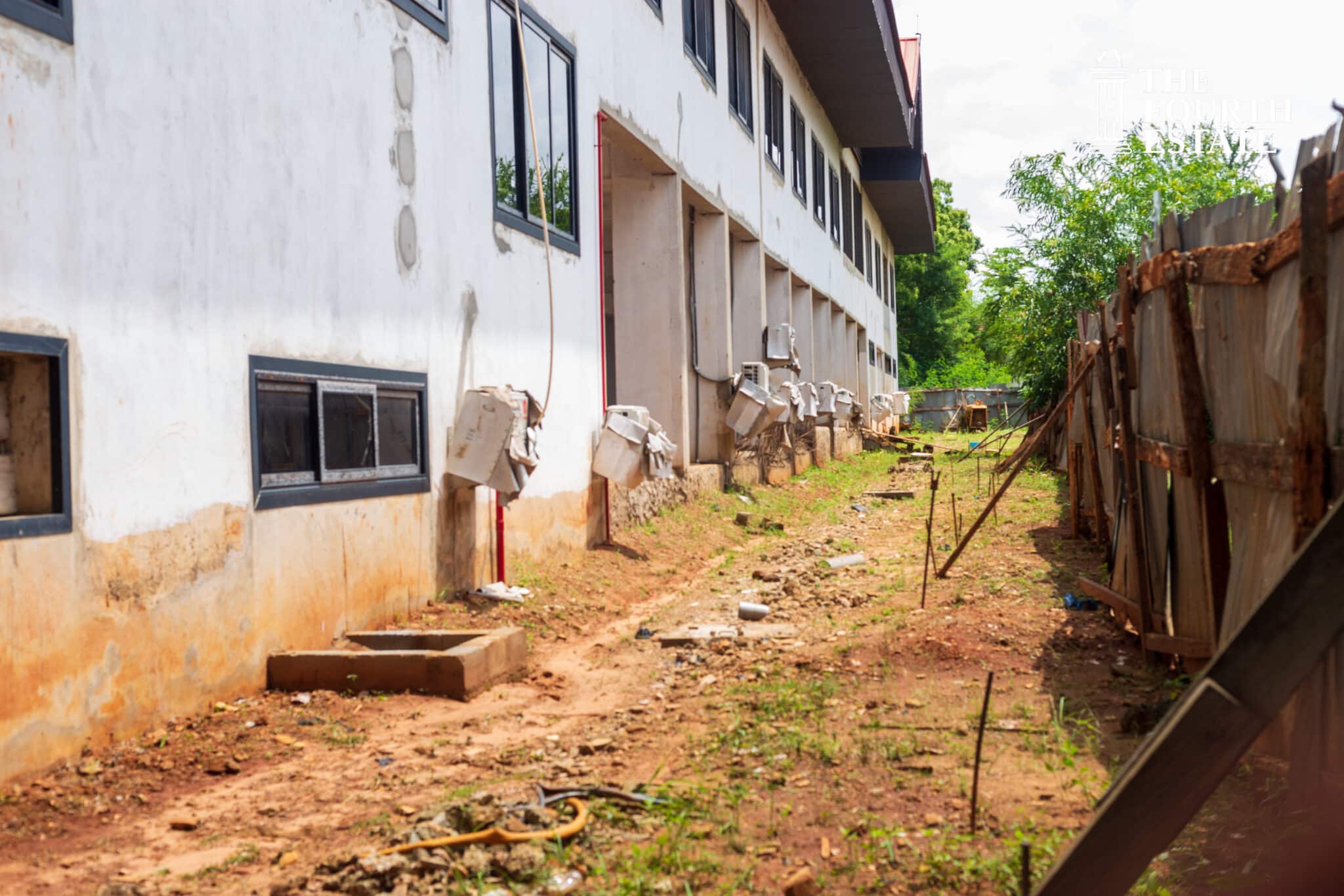 Side view of the abandoned University of Ghana school of Performing Art Multi-Purpose Arts Facility with mounted air conditioner inverters left at the mercy of the weather
