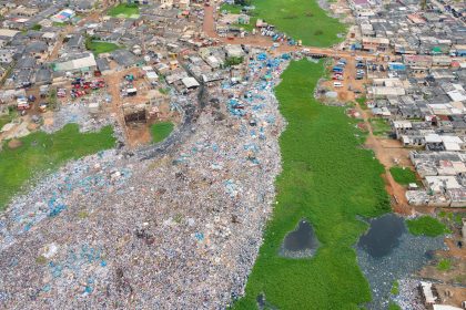 A lagoon being filled with rubbish to reclaim the land