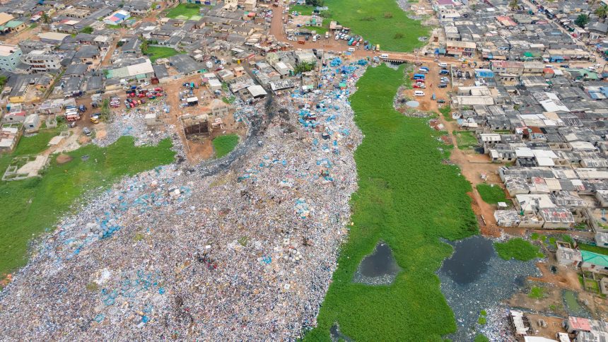 A lagoon being filled with rubbish to reclaim the land